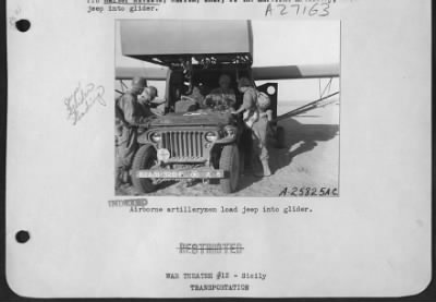 Thumbnail for Consolidated > Airborne artillerymen load jeep into glider.