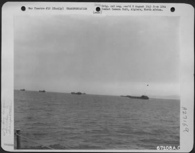 Thumbnail for Consolidated > An LST (Landing Ship Tanks) convoy, loaded with supplies, heads for the shore near Gela, Sicily. July 1943.