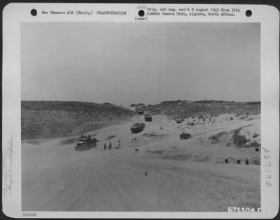 Thumbnail for Consolidated > A steady stream of "ducks" shuttles back and forth between LST's (Landing Ship Tanks) and the supply dump near Gela, Sicily. July 1943.