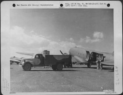 Thumbnail for Consolidated > A Douglas C-47 transport plane is unloaded at Cassibile, Sicily. 2 October 1943.