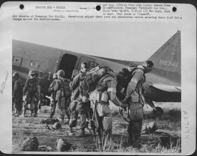 Thumbnail for Consolidated > Air Aspects of Campaign For Sicily. Paratroops adjust their pack and parachutes before entering their C-47 for a voyage across the Mediterranean.