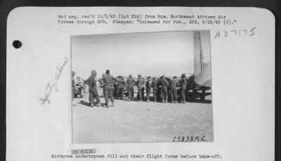 Thumbnail for Consolidated > Airborne infantrymen fill out their flight forms before take-off.