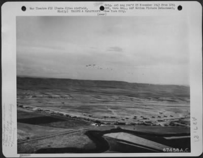 Thumbnail for Consolidated > After releasing gliders (Waco CG-4's) tow planes (Douglas C-47's) drop the paratroopers which they have carried as well as towing gliders which participated in the 52nd Troop Carrier Wing maneuvers over Sicily in 1943. The gliders were also loaded