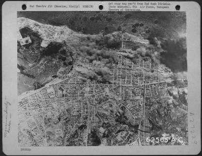 Thumbnail for Consolidated > Bombing of harbor installations at Messina, Sicily, on 5 July 1944, by planes of the 2nd Bomb Division, 8th Air Force. Altitude 26,000 feet.