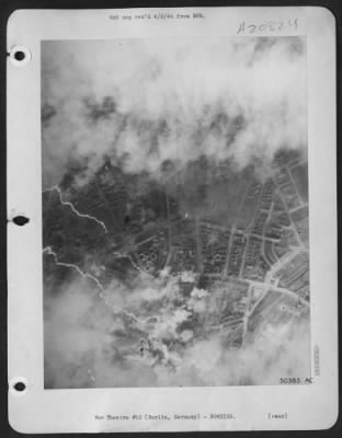 Consolidated > Wedding District of Reich capital--Although visibility was poor, cloud formations parted long enough for the camera to record hits on the Wedding District of Berlin, just north of the famous Tiergarten during an all-out attack by U.S. 8th AF