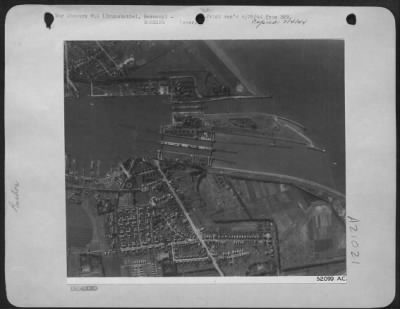 Consolidated > BEFORE THE ATTACK--The dock area at Brunsbuttel in Northern Germany is shown here a few minutes before the U.S. Eighth AF heavy bombers dropped heavy concentrations there 18 June 44.