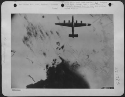 Consolidated > German Air Force Fighter production tumbles-Plane is Consolidated B-24 Liberator leaving Gotha, Germany on 24 Feb 1944.