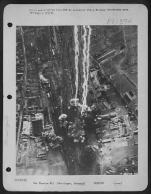 Consolidated > GOTTINGEN GETS IT--Erupting bombs spray destruction in their path as they strike with pin-point accuracy at the heart of the rail marshalling yards at Gottingen, Germany. This is part of the huge daylight assault of Nazi communications by U.S. Army