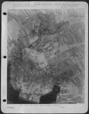 Thumbnail for Consolidated > Hundreds of bomb craters pattern the German airfield at Kirch Gans, Germany, a target for Allied air attacks.