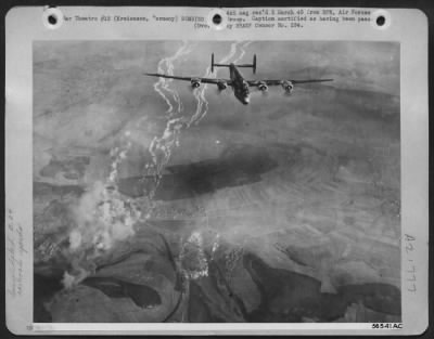 Consolidated > Bombing at levels less than 10,000 feet, Consolidated B-24 Liberators of the U.S. Eighth Air Force pounded Nazi communications centers throughout Germany 22 Feb 45, in a large scale daylight operation. Here a Liberator passes over the burning
