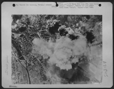Consolidated > One of three important rail yards hit in precision attacks by Marauders and Invaders of Maj. Gen. Samuel E. Anderson's medium bomber force on 25 March 1945, the yard at Limburg, Germany is seen here with smoke billowing skyward. All lines were