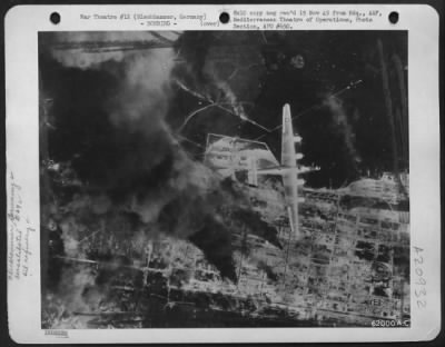 Consolidated > Bomb Strike By Consolidated B-24 Liberators Of 15Th Af On Oil Refinery At Blechhammer, Germany.  Here A Consolidated B-24 Liberator Flies Over The Smoking Target.  27 Aug 1944.