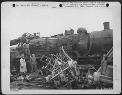 Consolidated > Locomotive Wrecked In The Heavily Bombed And Strafed Railyard At Dasburg, Germany.  Rail Traffic As Well As Road Traffic Was Brought To A Vitual Standstill By Continuous Air Pounding.  7 Feb 1945.