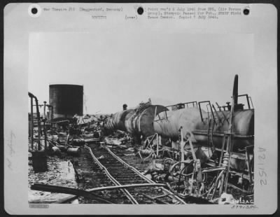 Consolidated > The Fuel Supplies In These Wrecked Tank Cars And Oil Storage Tanks At Deggendorf, Germany, Were Slated For Use By The Germans In A Last-Ditch Stand In The Southern Area Of 'National Redoubt'.  A Highly Accurate Attack By Douglas A-26 Invaders Of The 9Th A