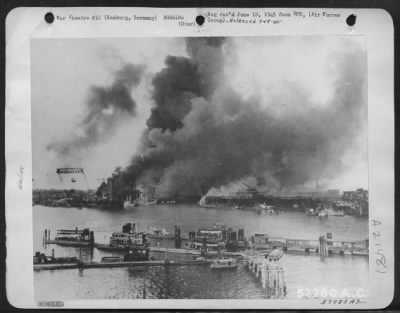 Thumbnail for Consolidated > Germans Took Pictures Of Hamburg After One Of The Allied Attacks, After Which Europe'S Largest Port Lay In Disuse.  Smoke Billows Black From The Supply Dumps At The Port, As Docks And Ships Go Down Into The Water.