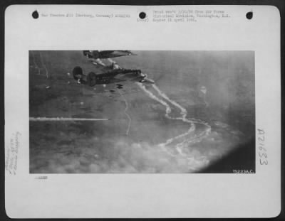 Consolidated > Bombs Are Dropped From Consolidated B-24 Liberators Of The 489Th Bomb Group On Enemy Installations At Hamburg And Harburg, Germany During A Raid On 6 Oct. 1944.