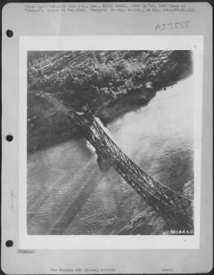 Thumbnail for Consolidated > Dara Bridge Before Bombing. Low Flying B-24 Has Just Dropped Short-Delay Bomb Whose Splash Is Seen Near Center Pier.