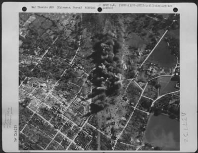 Consolidated > Bomb Bursts Completely Cover The Railroad Yards At Pyinmana, Burma After Planes Of The 12Th Bomb Group, 434Th Bomb Squadron Have Flown Over And Dropped Their Lethal Loads On 2 December 1944.