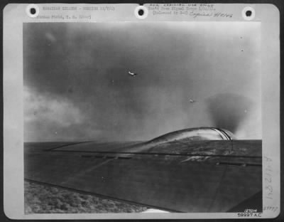 Consolidated > One Of The First Photos Of The Bombing Of Hickam Field, Hawaii, Dec. 7, 1941.  Unidentified Planes Over Army Airfield, Hawaii.  War Theatre #22 - Hawaii.