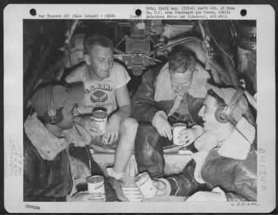 Consolidated > Returning From Raid Over Wake Island, On 30 April 1944, Crew Members On The Consolidated B-24 Liberator 'Kansas Cyclone', Relax As They Sip Canned Grapefruit Juice. 26Th Bomb Squadron, 11Th Bomb Group, 7Th Bomber Command.