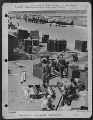 Thumbnail for Consolidated > Men Of The 318Th Fighter Group Packing Generators And Other Equipment For Shipment.  Bellows Field, Oahu, Hawaii, 15 May 1944.