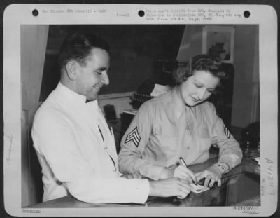 Thumbnail for Consolidated > In The Officers Mess Of The Air Transport Ommand In Hawaii, Wac Sgt. Edna C. Amstutz Of 2929 Detonshire Ave., St. Louis, Missouri, Learns How To Fill Out A Cashier'S Slip From Cpl. Clarence Packard Of 906 Furnace St., Joplin, Mo., Whose Duties She Is Taki