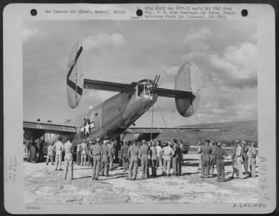 Thumbnail for Consolidated > Men Attempt To Raise The Nose Of A Consolidated B-24 Liberator Of The 864Th Bomb Squadron, 494Th Bomb Group, Which Crash Landed Near The Barking Sands Airstrip, Kauai, Hawaii, On 2 November 1944.  Men Are Packed Inside The Fuselage Near The Tail To Weight