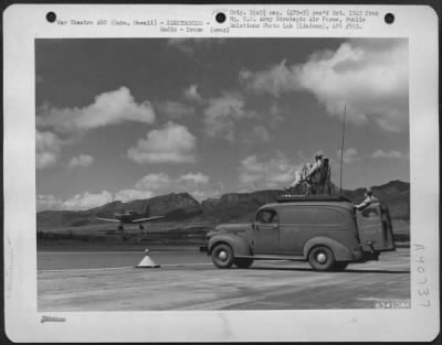 Consolidated > Metal Stick Operator, On Top Of Radio Control Truck, Guides Culver Pq 8A 'Red Fox', Radio Controlled Airplane On Take Off.  Wheeler Field, Oahu, Hawaii, April 45.