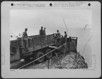 Consolidated > Truck Is Backed Up To Garbage Rack And Then Rubbish Is Dumped Into The Sea, Saipan, Marianas Islands.