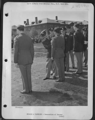 Groups > 'Unremitting Vigil' Of Technical Sergeant Donald E. Lahmers And 50 Other Officers And Men Of The Anti-Submarine Command Was Hailed At Mitchel Field, New York, Ceremonies By Brigadier General Westside R. Larson. The General, Shown Pinning The Air Medal On