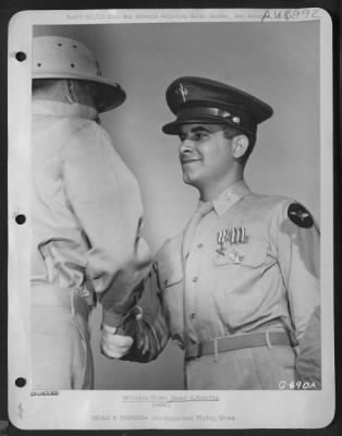 Groups > Aviation Cadet James M. Kokales - A Veteran Of 61 Combat Missions In Flying Fortresses As An Enlisted Man, Aviation Cadet James M. Kokales Of Oakmont, Pa., Receives A Handshake Form Colonel Michael F. Davis, Commanding Officer Of The San Antonio Aviation