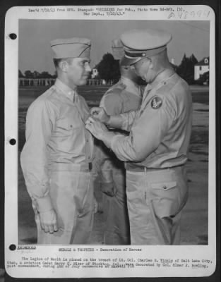 Groups > The Legion Of Merit Is Pinned On The Breast Of Lt. Colonel Charles B. Winkle Of Salt Lake City, Utah, & Aviation Cadet Harry D. Miser Of Stockton, Cal., Were Decorated By Colonel Elmer J. Bowling, Post Commandant, During 4Th Of July Ceremonies At Maxwell