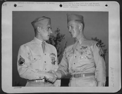 Groups > Two South Pacific Vets Honored, Buckley Field, Colo. - Veterans Of The Aerial Warfare Against The Japanese In The Pacific, S/Sgts. Leroy A. Schichner Of Chicago, Illinois, (Left) And Robert J. Collings Of Pawtucket, Tenn., Congratulate Each Other On The H