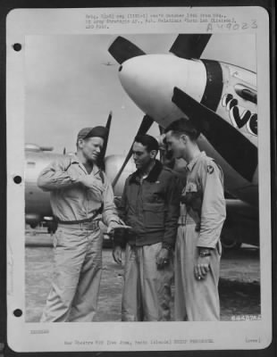 Groups > Capt. A. Crim Of Miami, Florida, Who Was High Man On The Day'S Escort Mission Over Tokyo, Japan, Describes The Flight To Brig. General Ernest M. Moore And Mahor Dewitt Spain Of Memphis, Tenn. Capt. Crim Shot Down Two Enemy Planes, 7 April 1945. Iwo Jima,