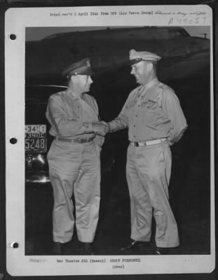 Groups > Hawaii. General George C. Kenney, Left, Commanding General Of The Pacific Air Command, United States Army, Is Shown Being Welcomed To Hickam Field By Brigadier General E. B. Lyon, Then Commanding General Of The Aaf In The Middle Pacific But Since Reassign
