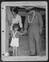 Lt. General Ira C. Eaker, Right, Deputy Commander Of The Army Air Forces, Received A Typical Hawaiian Welcome On His Arrival At Hickam Field, 24 April 1946 On The First Leg Of An Extensive Inspection Tour Of Pacific Air Bases. He Is Shown Wearing The Trad - Page 1