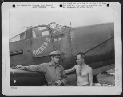 Groups > 1St Lt. J. H. Carlyle Of Gilroy, Calif., Chats With Sgt. E. J. Brown Of Toledo, Ohio Besides The Bell P-39 'Racker Ii'. Lt. Carlyle Shot Down Two Japanese Plane Over Makin Island. Haleiwa, Oahu, Hawaii.
