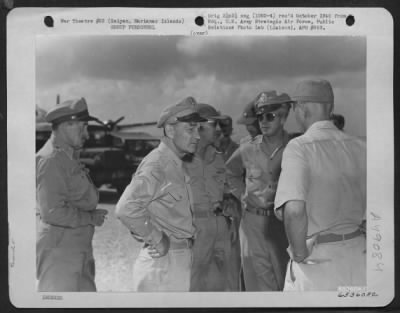 Groups > Lt. General Millard F. Harmon Chats With Fellow Officers During Short Visit To Saipan, Marianas Islands. They Are, Left To Right: Brig. General Martin F. Scanlon, General Harmon, Major General Elmer E. Adler And Brig. General Lawrence J. Carr.