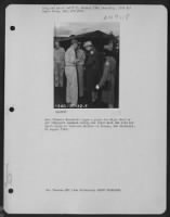Mrs. Eleanor Roosevelt Signs A Paper For Major Wolf Of Air Transport Command During Her Visit With The 13Th Air Depot Group At Tontouta Airbase In Noumea, New Caledonia. 25 August 1943. - Page 1