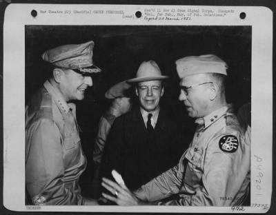Groups > Smiles From The Southwest Pacific. A Jovial Mood Of General Macarthur, Left, Greeting Major General Ennis C. Whitehead, Deputy Commander, U.S. Army Fifth Air Force, Right Was Cought By An Alert Photographer During The Visit Of Under Secretary Of War Rober