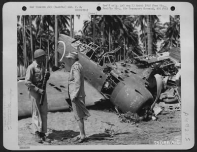 Groups > During Her Tour Of The Pacific Area Mrs. F. D. Roosevelt Chats With Pvt. Clarence D. Robertson From Tulsa, Okla, Who Guards A Wrecked Jap Zero At Guadalcanal, Solomon Islands, 1943.