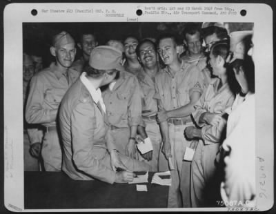 Groups > During Her Tour Of The Pacific Bases Mrs. F. D. Roosevelt Jokes With Enlisted Men At Guadalcanal As She Give Autographs. Solomon Islands, 1943.