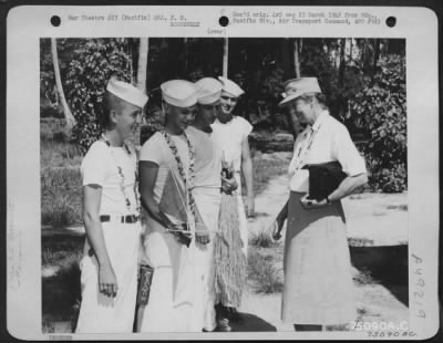 Groups > During Her Tour Of The Pacific Area Mrs. F. D. Roosevelt Chats With Daniel J. Spaulding, Washington, D.C.; Robert A. O'Neill, New York City; George R. Vosper, Stuberville, Ohio, And Wm. E. Cadwallader, Pittsburg, Pa. At Bora Bora, Society Islands, 1943.