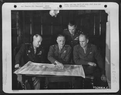 Groups > General Spaatz Confers With Other Generals Of His Command At An Air Base In England.  They Are, Left To Right: Major General Ralph Royce, Lt. General Carl Spaatz, Major General Hoyt S. Vandenberg And Major General Hugh J. Knerr.