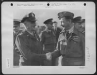 Air Chiefs' Au Revoir. --- Lt. Gen. Carl Spaatz, Left, Named As Commander, U.S. Strategic Bombing Forces Shakes Hands With British Air Marshal, Sir Arthur W. Tedder, Named Deputy Commander, Allied Forces, Organizing In Britain, As They Parted At A Base So - Page 1