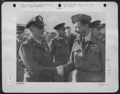 Groups > Air Chiefs' Au Revoir. --- Lt. Gen. Carl Spaatz, Left, Named As Commander, U.S. Strategic Bombing Forces Shakes Hands With British Air Marshal, Sir Arthur W. Tedder, Named Deputy Commander, Allied Forces, Organizing In Britain, As They Parted At A Base So