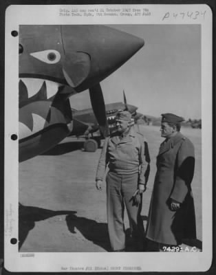 Groups > During His Visit To China, Lt. General Henry H. Arnold Looks At A Curtiss P-40 With Brig. General Claire L. Chennault, Leader Of The Famed "Flying Tigers." February 1943.
