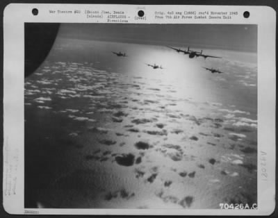 Thumbnail for Consolidated > Consolidated B-24 Liberators Of The 26Th And 431St Bomb Squadrons, 11Th Bomb Group, Attacked Jap Shipping In The Harbor At Chichi Jima, Bonin Islands On 19 November 1944.  Here, A Formation Of The Liberators Roar Over A Wide Expanse Of The Ocean.