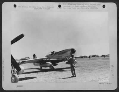 Thumbnail for North American > Man Signals To Pilot Who Is Parking His North American P-51 "Mustang" On No. 1 Airfield, Iwo Jima, Bonin Islands. 6 March 1945.