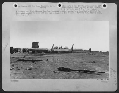 ␀ > A Northrop P-61 Black Widow On Iwo Jima, Attempted A Blind Landing In A Fog Aided By An/Mpn-1 Unit. Cross Wind Carried The Plane Off Line And It Landed On Top Of Another Northrop P-61, Finally Coming To A Stop As Shown.